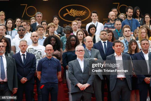 Director of the Cannes Film Festival Thierry Fremaux leads a minute of silence for the victims of the Manchester Terror Attack with other staff and...