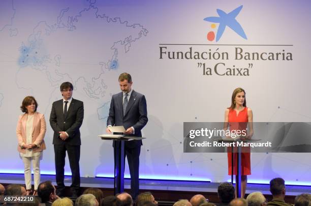 Soraya Saenz de Santamaria, Carles Puigdemont, King Felipe VI of Spain and Queen Letizia of Spain attend the 'La Caixa' Scholarships held at the...