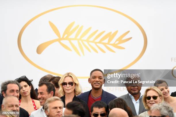 Charlize Theron and Will Smith attend the 70th Anniversary Photocall during the 70th annual Cannes Film Festival at Palais des Festivals on May 23,...