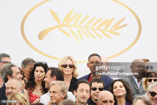 Charlize Theron and Will Smith attend the 70th Anniversary Photocall during the 70th annual Cannes Film Festival at Palais des Festivals on May 23,...