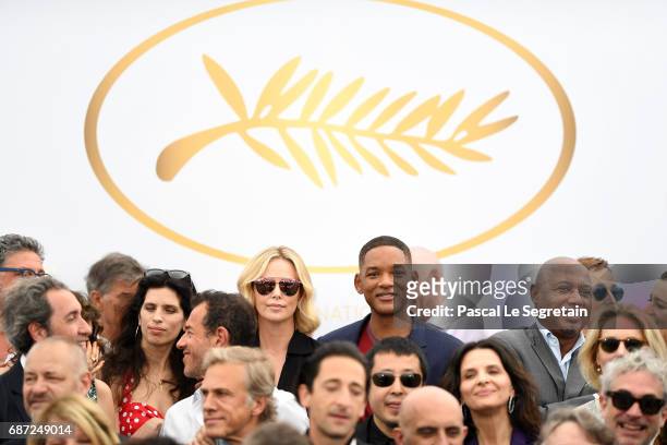 Charlize Theron and Will Smith attend the 70th Anniversary Photocall during the 70th annual Cannes Film Festival at Palais des Festivals on May 23,...