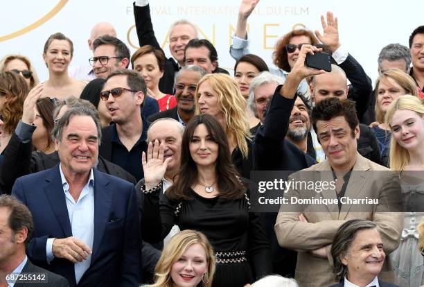 Oliver Stone, Monica Bellucci, Benicio del Toro and Elle Fanning and Kirsten Dunst attends the 70th Anniversary photocall during the 70th annual...