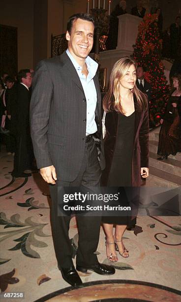 Actor David James Elliot, from tvs "JAG" arrives with an unidentified friend at the grand opening party for The Stirling Club December 14, 2001 in...