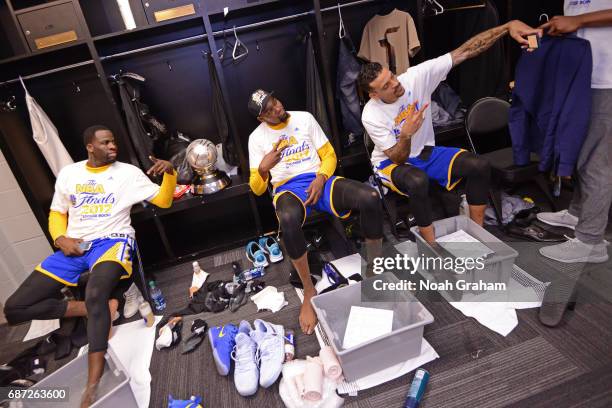 Draymond Green, Kevin Durant and Matt Barnes of the Golden State Warriors celebrate after winning Game Four of the Western Conference Finals during...
