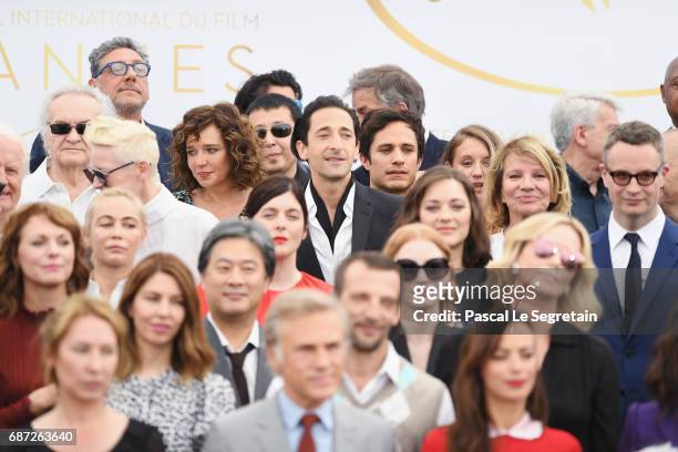 Valeria Golino, Adrien Brody and Gael Garcia Bernal and attends the 70th Anniversary Photocall during the 70th annual Cannes Film Festival at Palais...