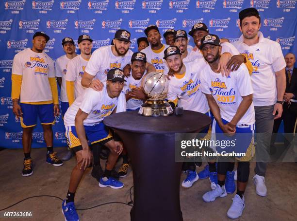 The Golden State Warriors pose for a photo with the Western Conference Championship Trophy after winning Game Four of the Western Conference Finals...