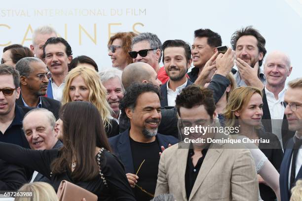 Alejandro Gonzalez Inarritu and Benicio del Toro attend the 70th Anniversary photocall during the 70th annual Cannes Film Festival at Palais des...