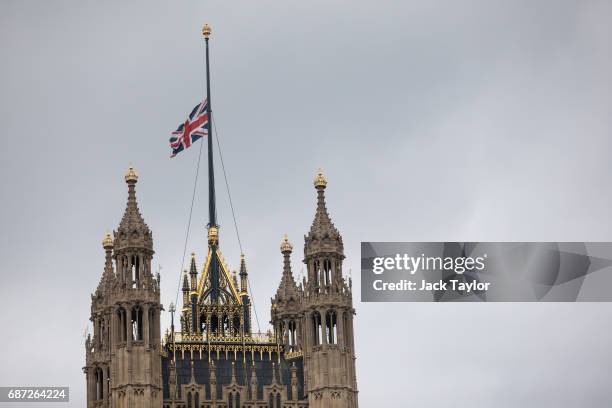 The Union flag flies at half mast above the Houses of Parliament in Westminster on May 23, 2017 in London, England. 22 people, including children...