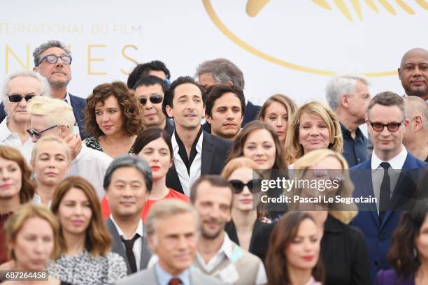 Valeria Golino, Adrien Brody and Gael Garcia Bernal and attends the 70th Anniversary Photocall during the 70th annual Cannes Film Festival at Palais...