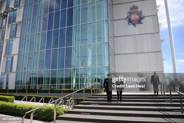 Britain's Prime Minister Theresa May talks with Chief Constable of Greater Manchester Police Ian Hopkins as they leave the Greater Manchester Police...