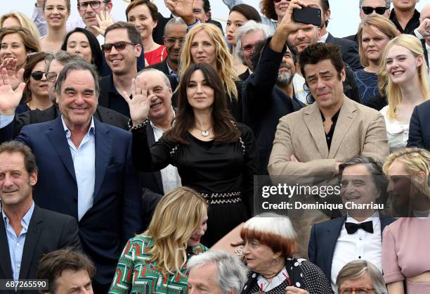 Oliver Stone, Monica Bellucci and Benicio del Toro attends the 70th Anniversary photocall during the 70th annual Cannes Film Festival at Palais des...