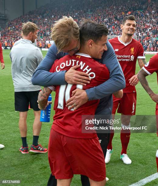 Manager Jurgen Klopp of Liverpool embraces Philippe Coutinho after the Premier League match between Liverpool and Middlesbrough at Anfield on May 21,...
