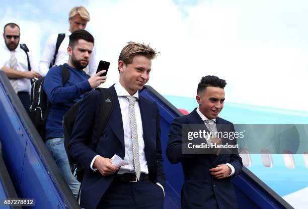 In this handout image provided by UEFA, Frenkie de Jong and Abdelhak Nouri of Ajax arrive with team mates ahead of the UEFA Europa League Final...