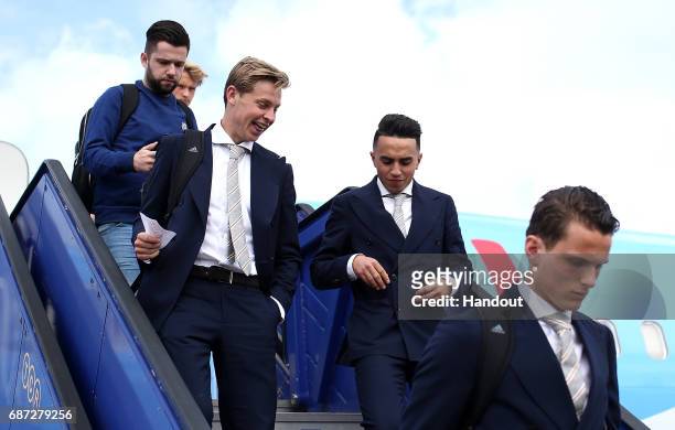 In this handout image provided by UEFA, Frenkie de Jong and Abdelhak Nouri of Ajax arrive with team mates ahead of the UEFA Europa League Final...