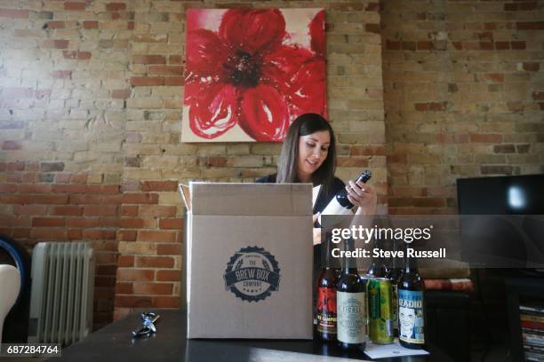 As the Shannon Rooney opens her box of beer at home that she recieved through a service called Brew Box. Craft breweries not able to get into the...