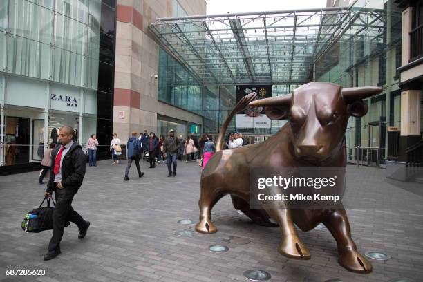 People out shopping by the Bullring Bull, also affectinately known as Bully in the public outdoor space at the Bullring in Birmingham, United...