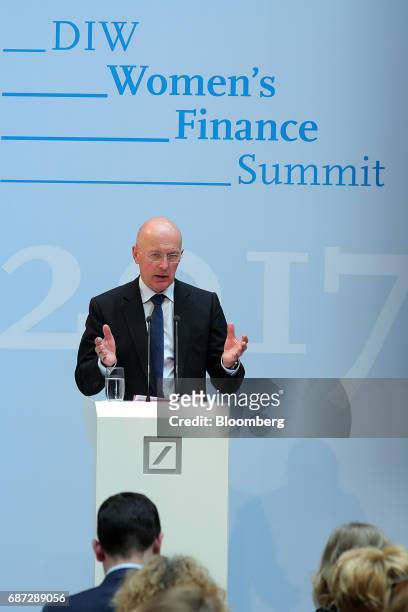 Philip Hampton, chairman of GlaxoSmithKline Plc, gestures while speaking during the German Institute for Economic Research in Berlin women's finance...