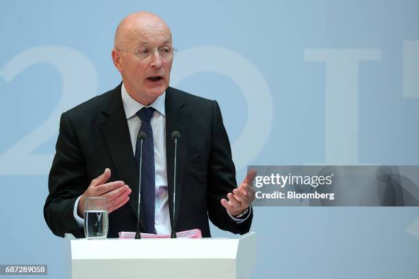 Philip Hampton, chairman of GlaxoSmithKline Plc, gestures while speaking during the German Institute for Economic Research in Berlin women's finance...