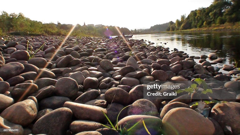 Round stones at river shore