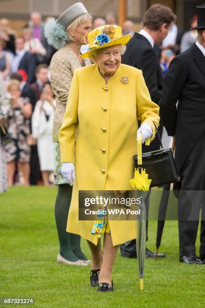 Queen Elizabeth II during the garden party at Buckingham Palace on May 23, 2017 in London, England. A minute's silence was observed for the victims...