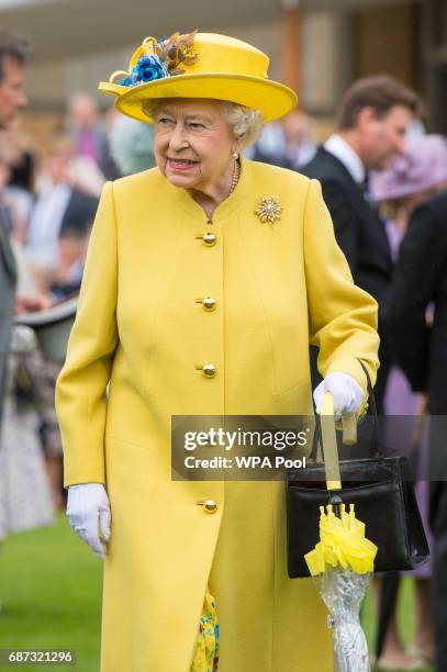 Queen Elizabeth II during the garden party at Buckingham Palace on May 23, 2017 in London, England. A minute's silence was observed for the victims...