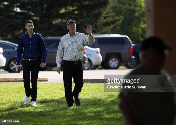 Republican congressional candidate Greg Gianforte greets supporters during a campaign meet and greet at Lions Park on May 23, 2017 in Great Falls,...