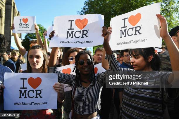 Members of the public gather at a vigil, to honour the victims of Monday evening's terror attack, at Albert Square on May 23, 2017 in Manchester,...