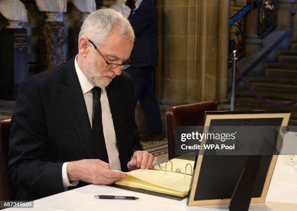 Labour leader Jeremy Corbyn signs a book of condolence at Manchester Town Hall on May 23, 2017 in Manchester, England. A 23-year-old man was arrested...