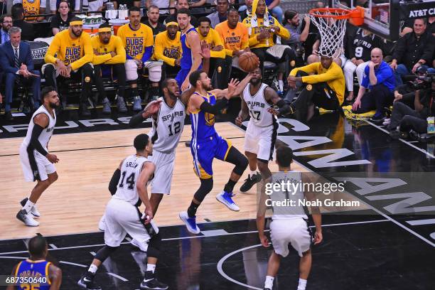 Stephen Curry of the Golden State Warriors drives to the basket against the San Antonio Spurs in Game Four of the Western Conference Finals during...