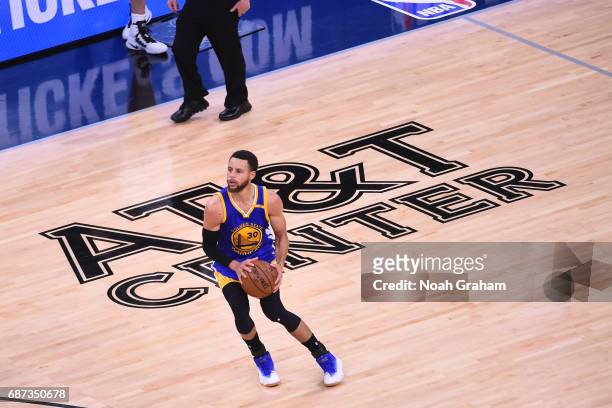 Stephen Curry of the Golden State Warriors spots up for a three point basket in Game Four of the Western Conference Finals against the San Antonio...