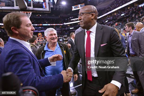 Joe Lacob and Mike Brown of the Golden State Warriors hug after winning Game Four of the Western Conference Finals against the San Antonio Spurs...