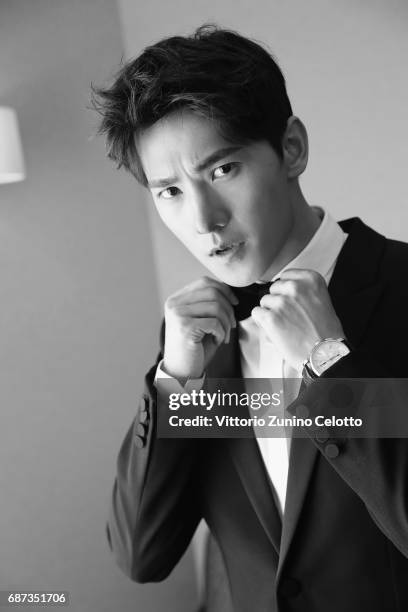 Actor Yang Yang prepares backstage at Majestic Hotell on May 23, 2017 in Cannes, France.