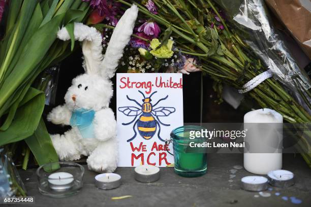 Floral tribute is laid during a candlelit vigil, to honour the victims of Monday evening's terror attack, at Albert Square on May 23, 2017 in...
