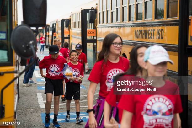Students arrive for the Speeding to Read Assembly at Texas Motor Speedway on May 23, 2017 in Fort Worth, Texas.