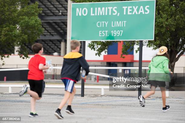 Students arrive for the Speeding to Read Assembly at Texas Motor Speedway on May 23, 2017 in Fort Worth, Texas.