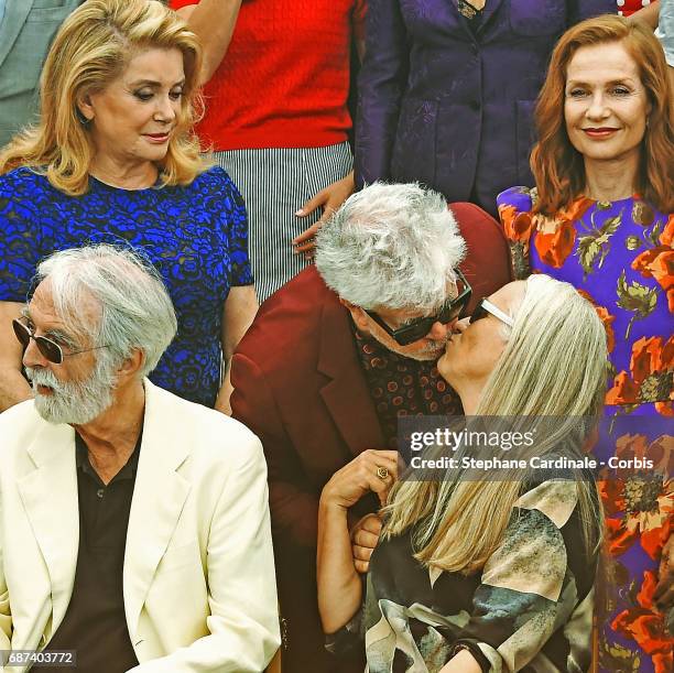 Catherine Deneuve and Isabelle Huppert look on as Pedro Almodovar kisses Jane Campion sitting next to Michael Haneke attends the 70th Anniversary...