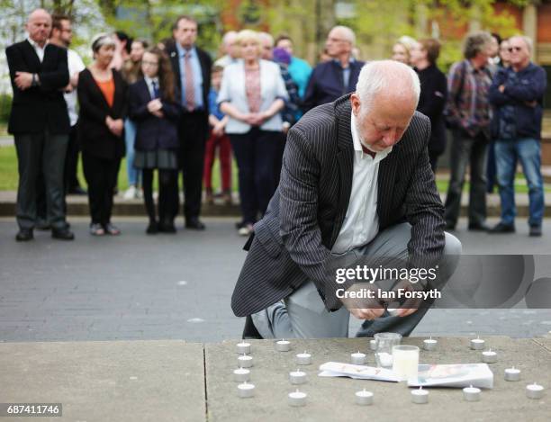 Local Labour MP Andy McDonald lights a candle during a small vigil held in Middlesbrough to pay respects to the victims of the recent attack in...