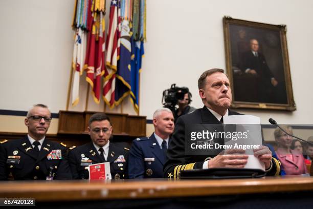 Admiral Michael Rogers, Director of the National Security Agency and commander of U.S. Cyber Command, arrives to testify during a House Armed...