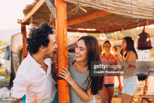 flirting in the summertime - beach vibes stock pictures, royalty-free photos & images