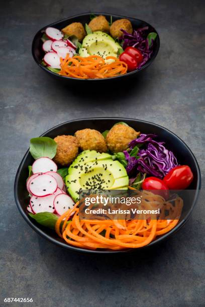 salad bowl with falafel and avocado - larissa veronesi bildbanksfoton och bilder