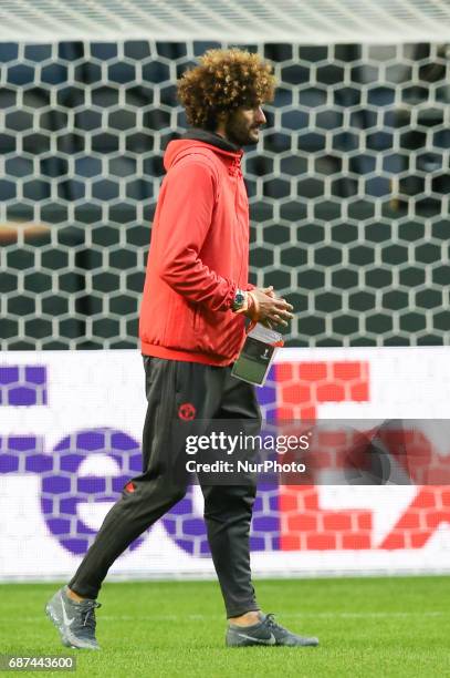 Manchester United's midfielder Marouane Fellaini attends a team training session at the club's training complex near Carrington, west of Manchester...