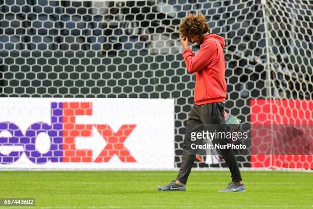 Manchester United's midfielder Marouane Fellaini attends a team training session at the club's training complex near Carrington, west of Manchester...