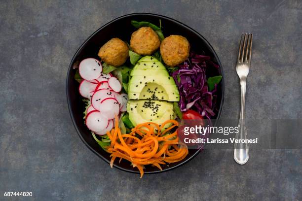 salad bowl with falafel and avocado - larissa veronesi bildbanksfoton och bilder