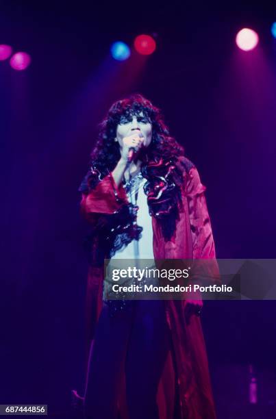 The singer-songwriter Renato Zero dancing in concert. Italy, 1980