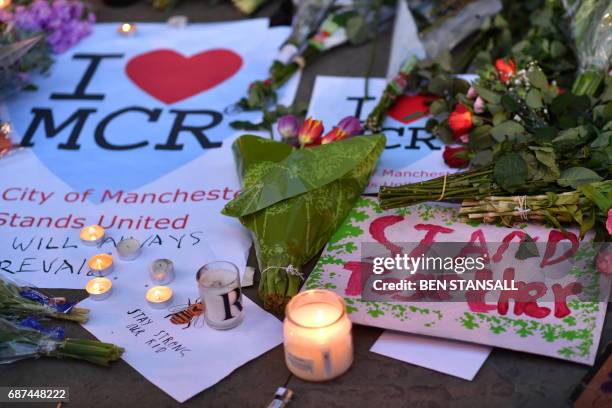 Messages and floral tributes are seen in Albert Square in Manchester, northwest England on May 23 in solidarity with those killed and injured in the...