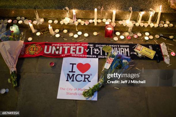 Members of the public attend a candlelit vigil, to honour the victims of Monday evening's terror attack, at Albert Square on May 23, 2017 in...