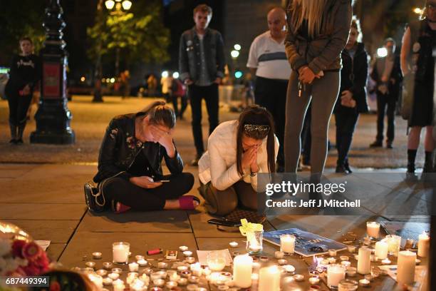 Members of the public attend a candlelit vigil, to honour the victims of Monday evening's terror attack, at Albert Square on May 23, 2017 in...