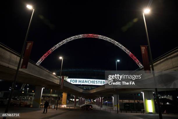 Wembley Stadium Lights up in tribute to the victims of the Manchester attacks at Wembley Stadium on May 23, 2017 in London, England.