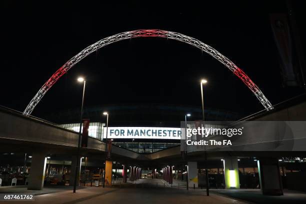 Wembley Stadium Lights up in tribute to the victims of the Manchester attacks at Wembley Stadium on May 23, 2017 in London, England.