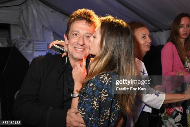 Composer Eric Serra and Julie Peugeot attend the Technikart Boat Party during the 70th annual Cannes Film Festival at on May 22, 2017 in Cannes,...